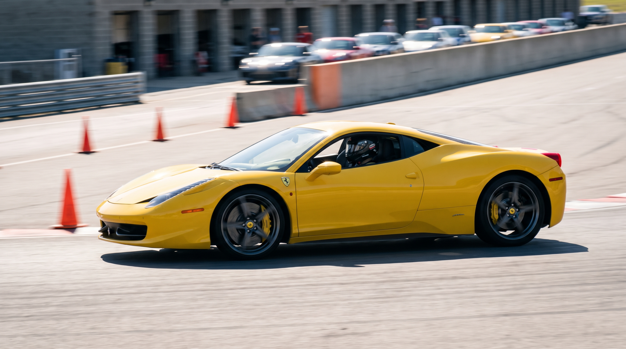 Exotic car financing and track day coverage: a supercar cornering at a high performance driving event