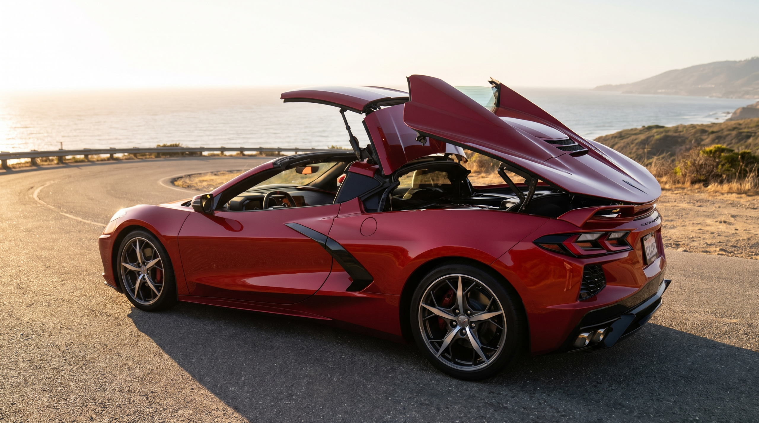 Ferrari 849 Testarossa Spider with its retractable hard top folding on a coastal road