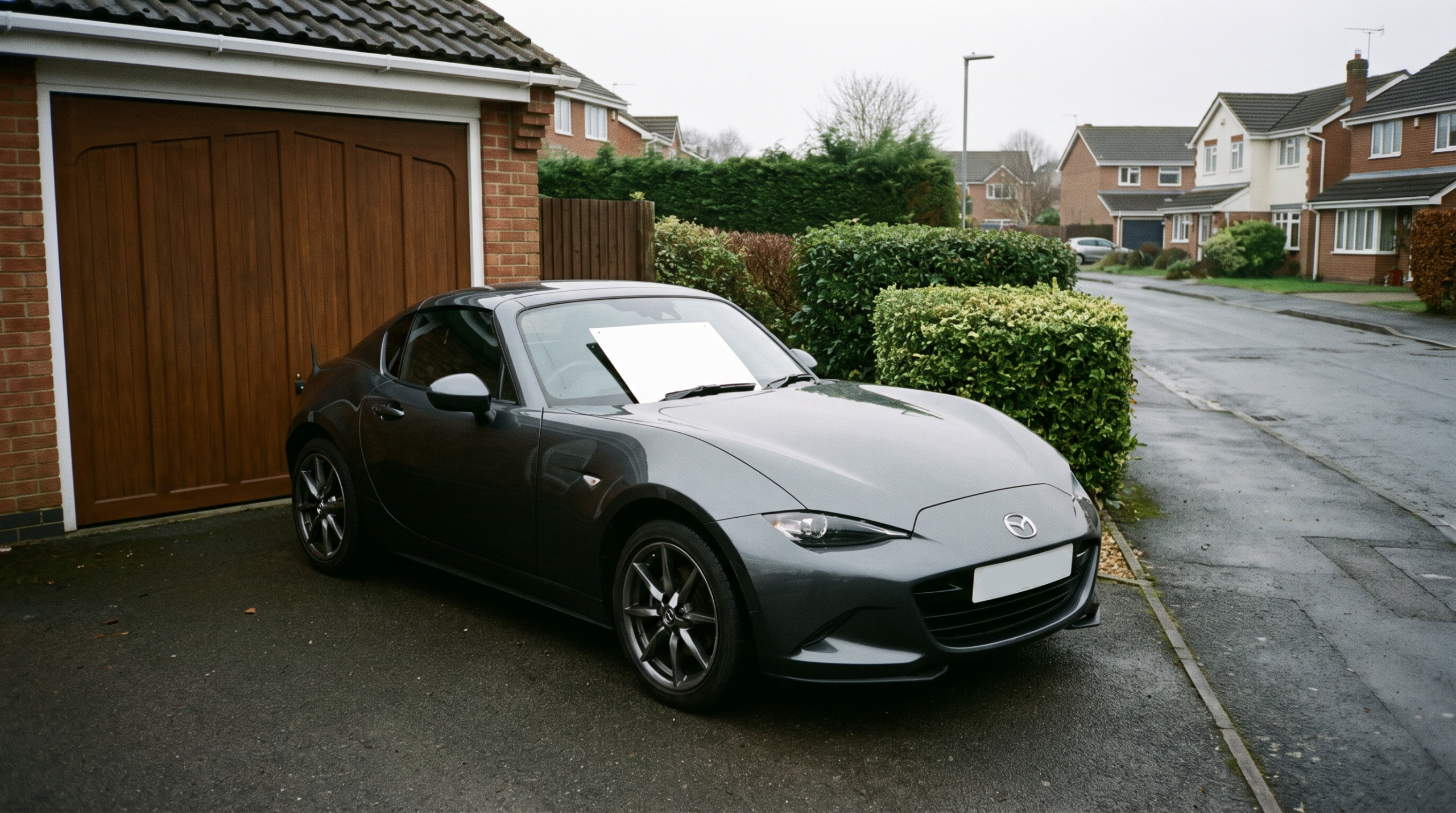 Car for sale on a driveway, the typical setting for a private seller transaction