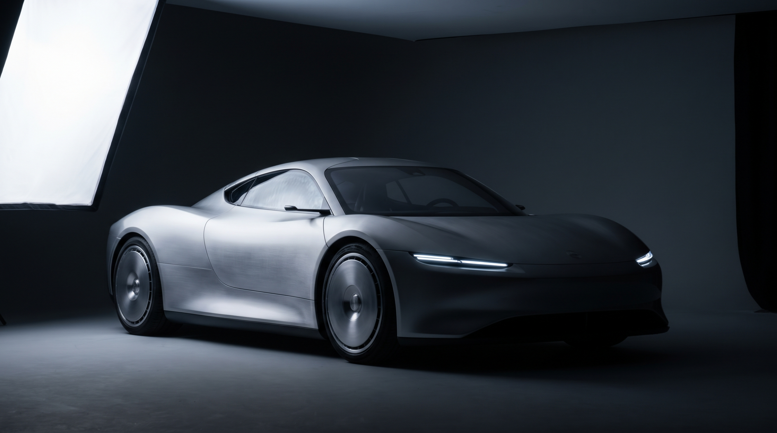 A silver electric hypercar concept half in shadow, representing cancelled upcoming exotic cars