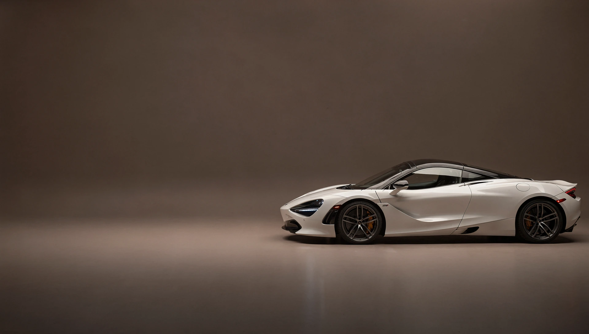 White McLaren 720S in a warm charcoal studio
