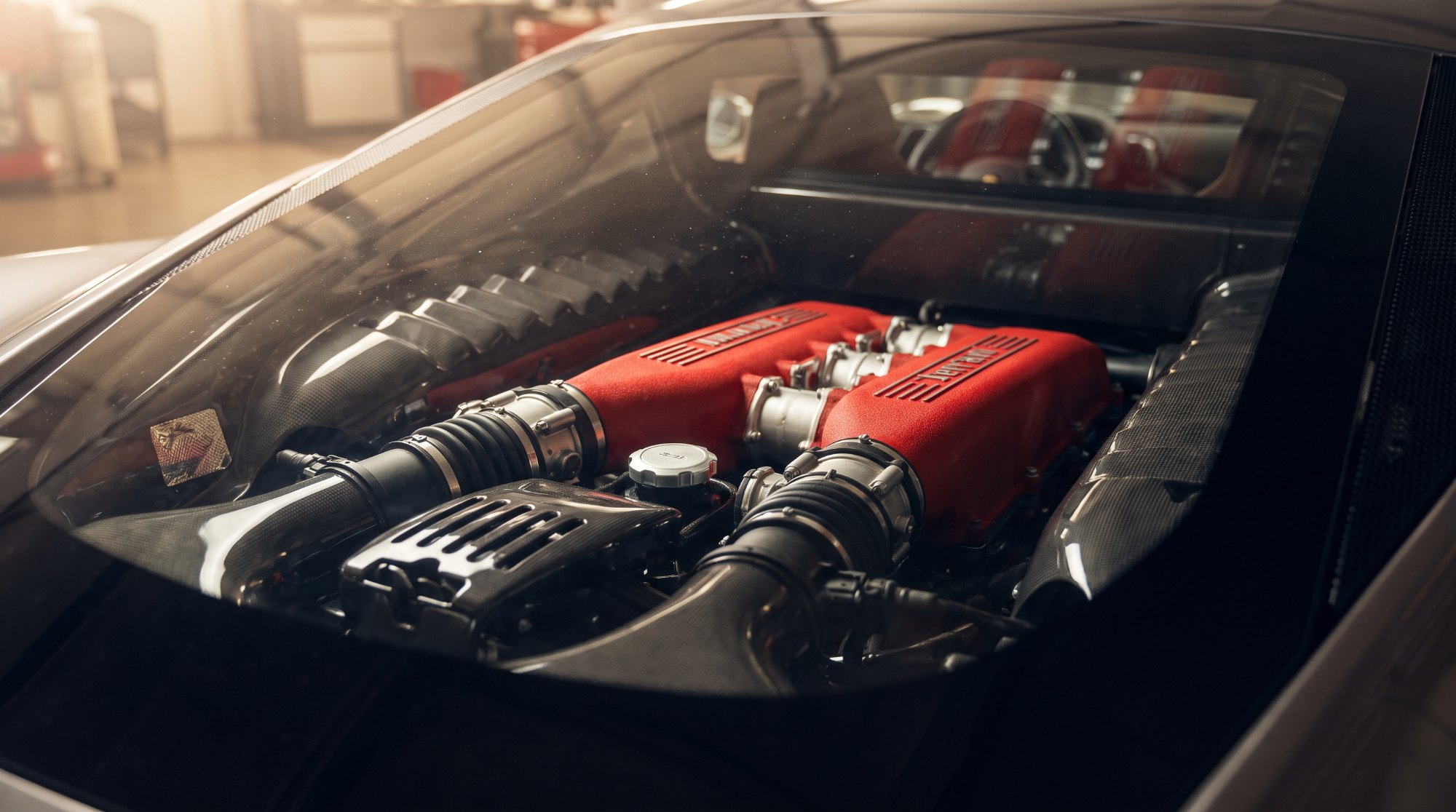 Ferrari 458 Italia 4.5-liter naturally aspirated V8 seen through the engine cover glass